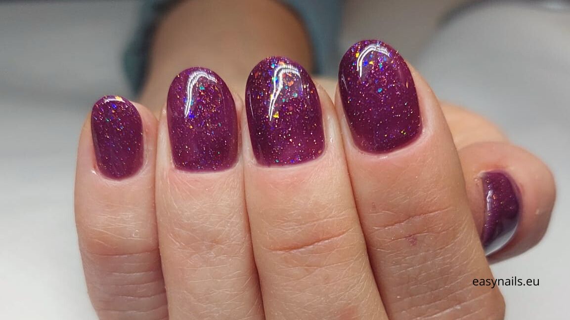 Purple Nails with Glitter: A Mysterious and Fashionable Look